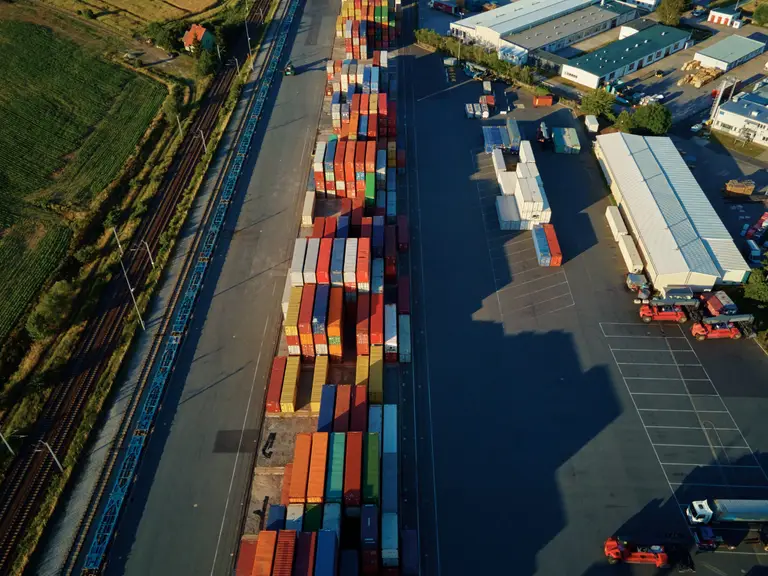 Transport at a site, depicting logistics and rail activity.