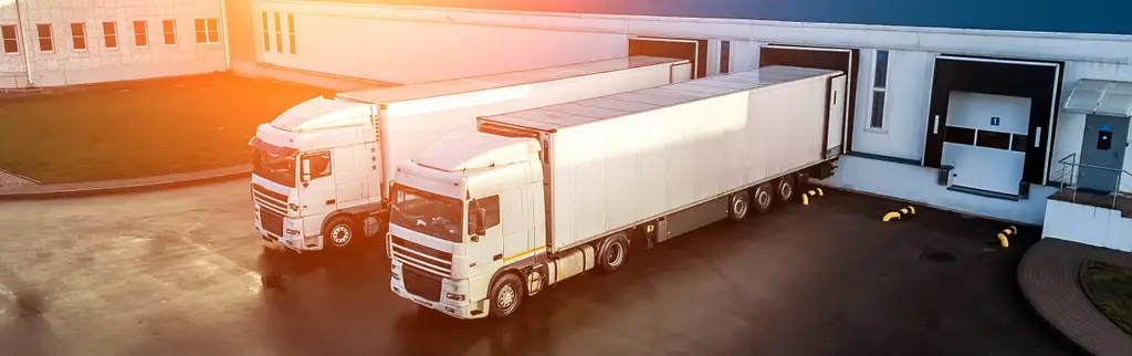 trucks are loaded in a modern logistics center..