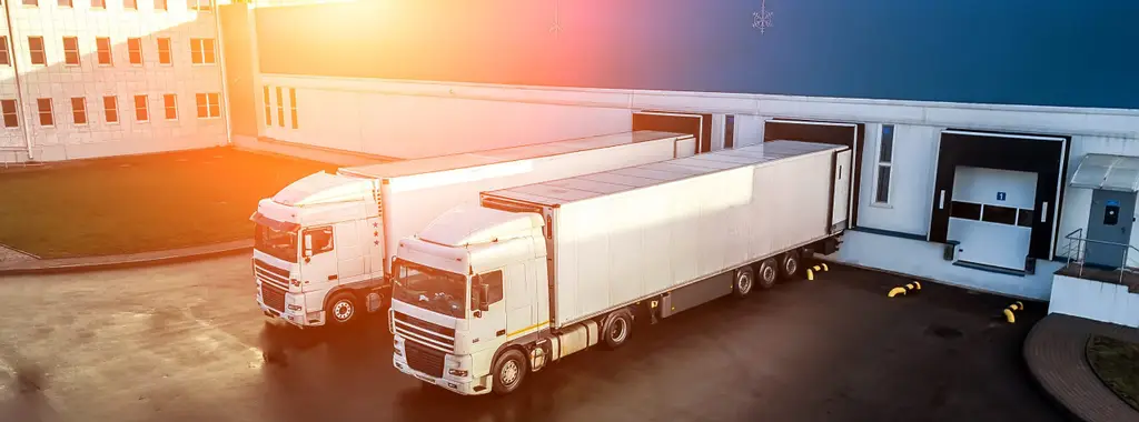 trucks are loaded in a modern logistics center..