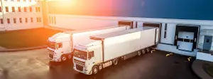 trucks are loaded in a modern logistics center..