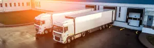 trucks are loaded in a modern logistics center..