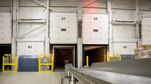 Automated loading and unloading doors are open at the warehouse