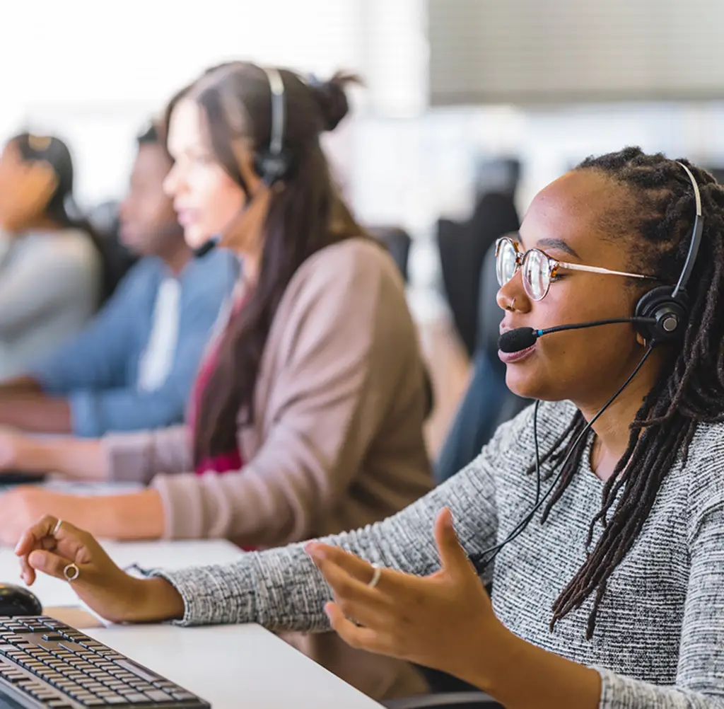 Call center employees working in a customer support environment