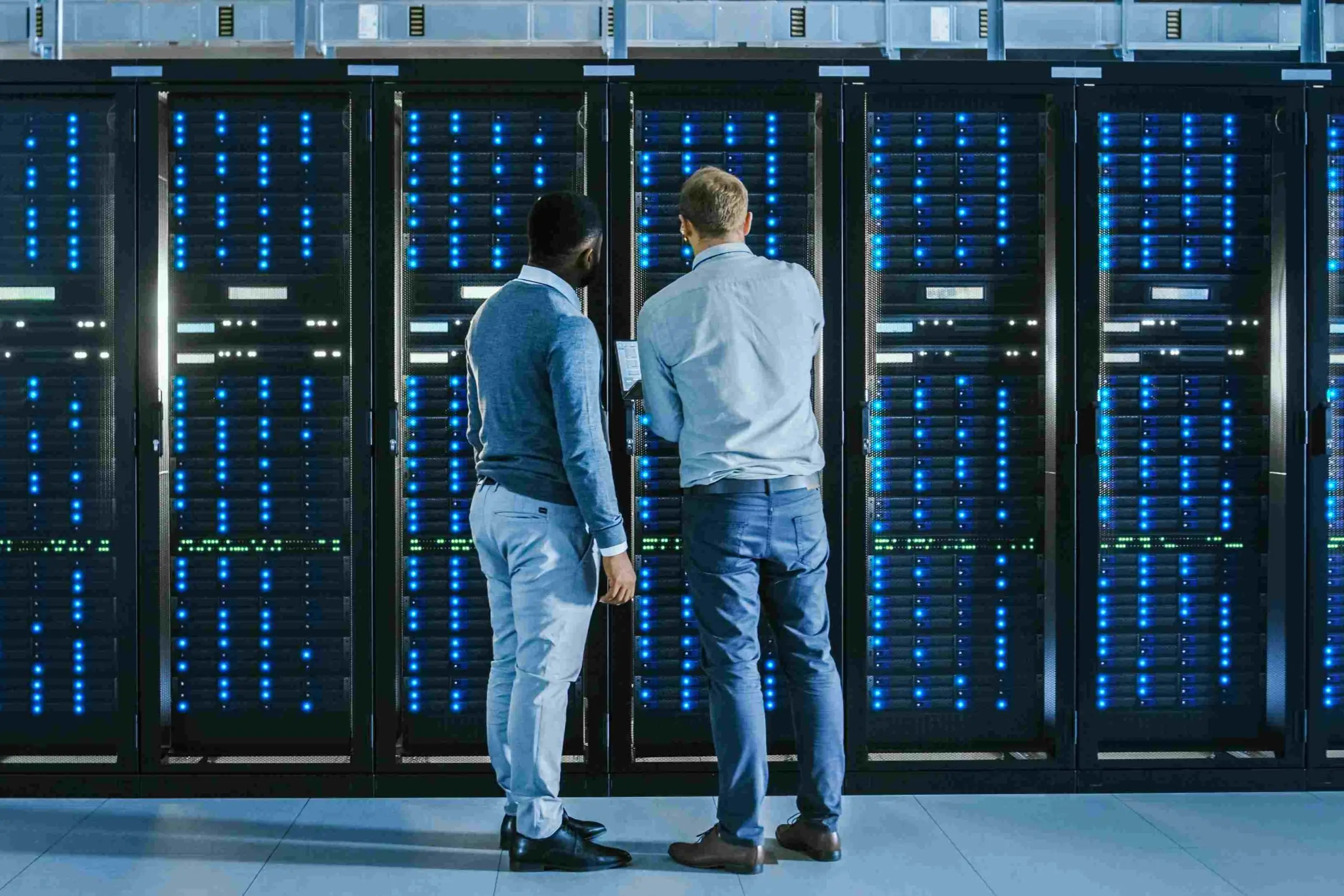 Two employees inspecting a data centre
