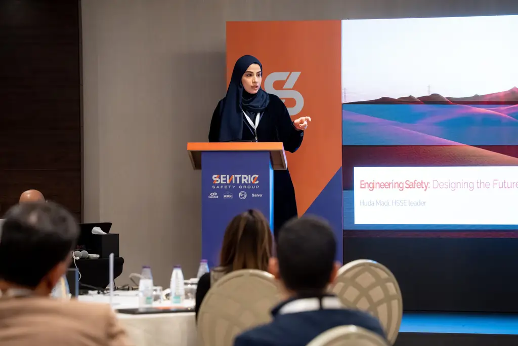 Speaker addressing crowd at Safety by Design in Saudi Arabia Evnt