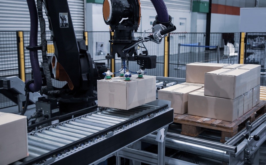 Robotic Arms are packaging a product on a warehouse, sign of automated loading and unloading system power.